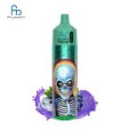 Fumot Tornado vape with colorful skull design and grapes.