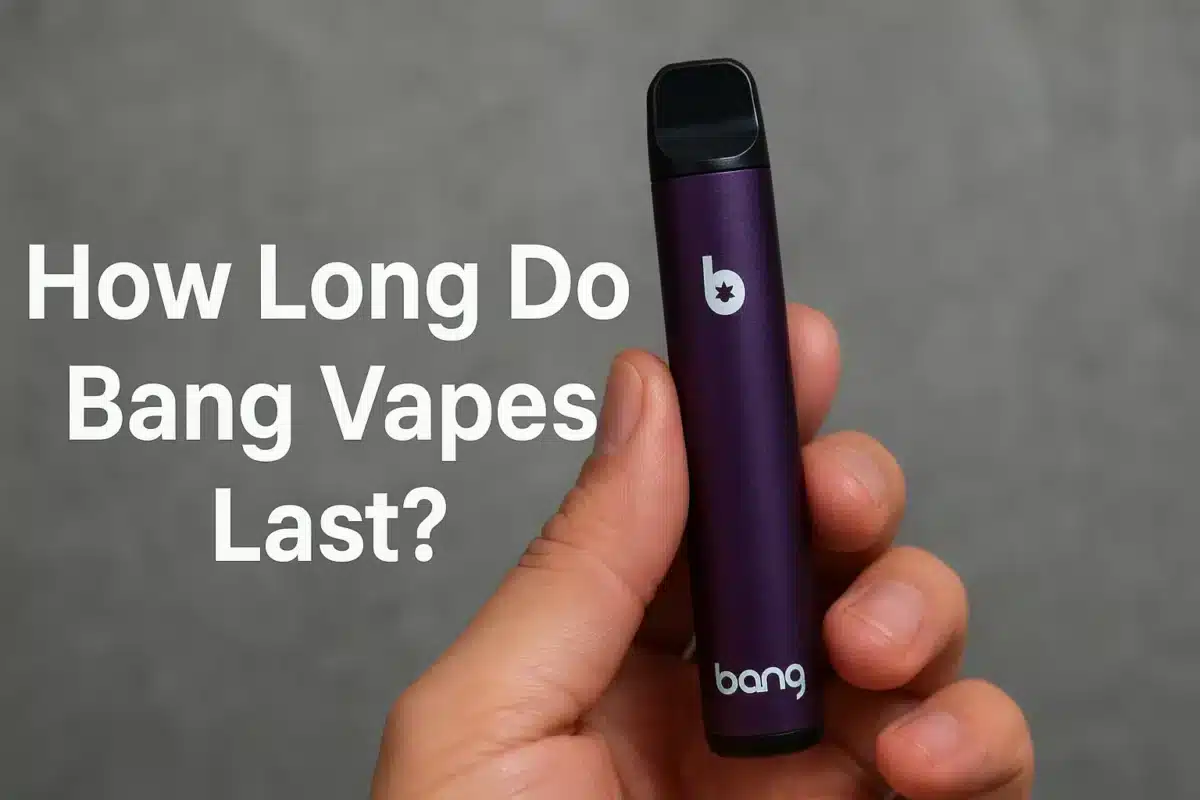 Hand holding a Bang vape pen, purple color.